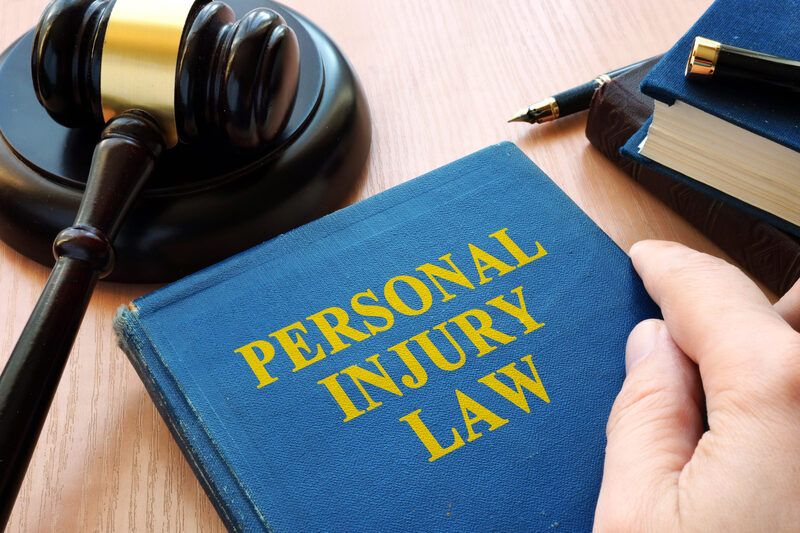 Personal injury law book used by a lawyer in Grand Junction.