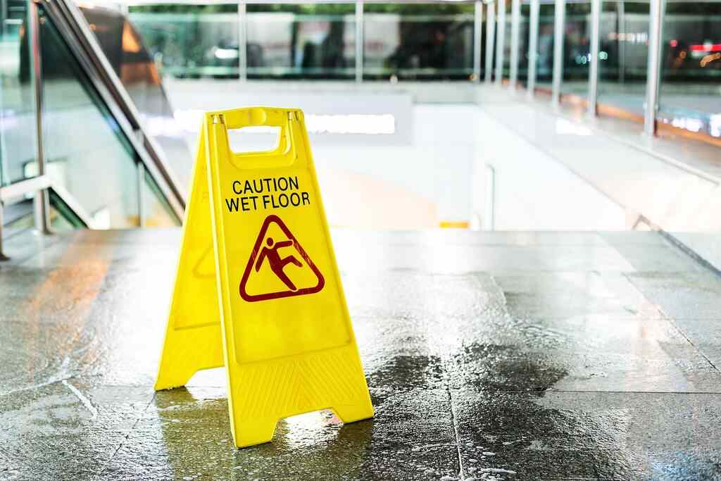 Grocery store with a slip and fall sign.